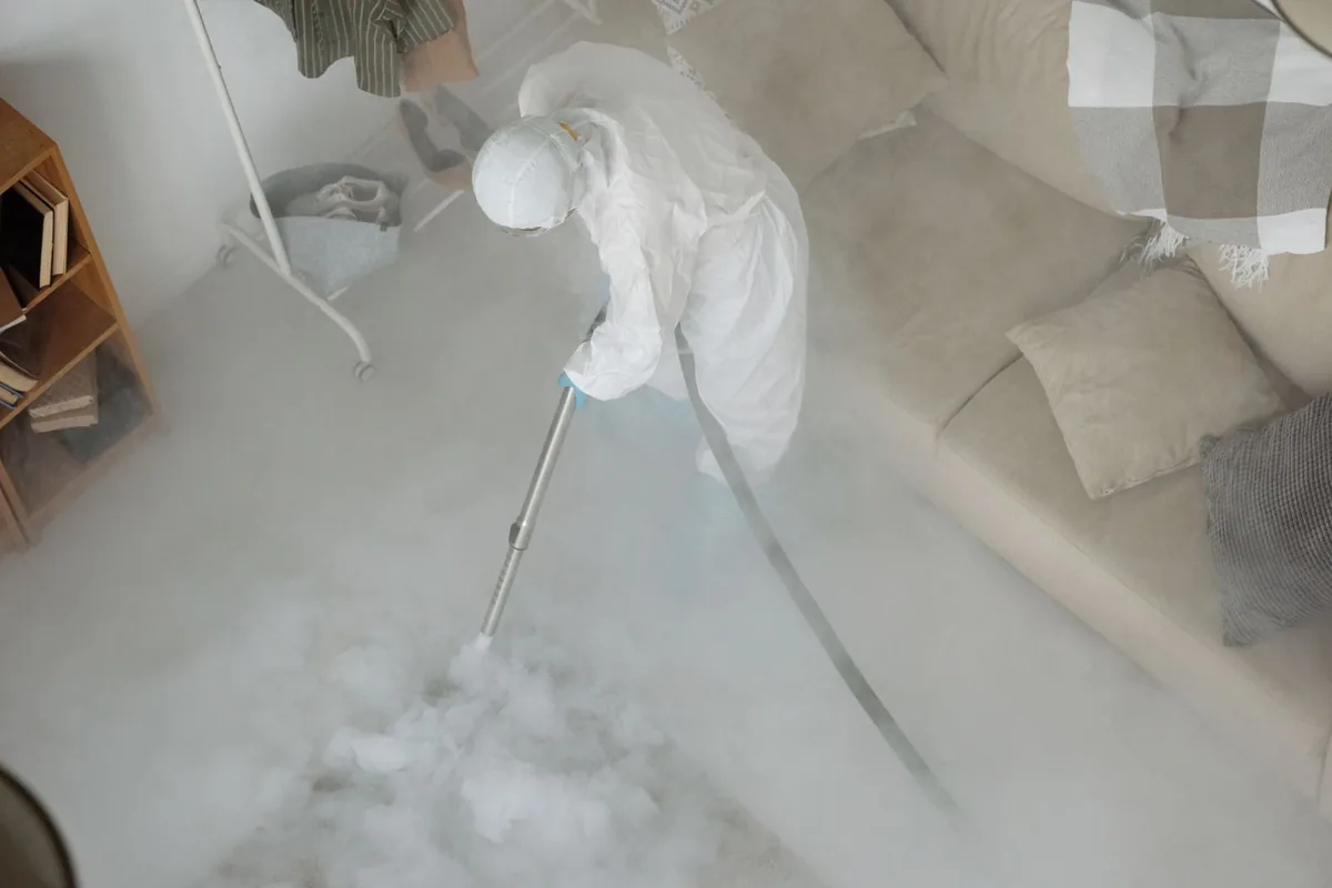 Biohazard cleanup technician in protective equipment, Killbuck, OH